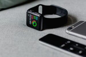 black smartwatch showing fitness rings and goals